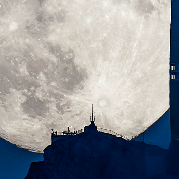 Supermoon Rising Above a Swiss Peak