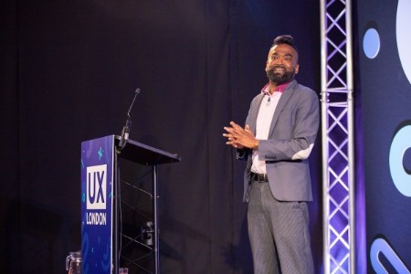 Rama Gheerawo on stage at UX London.