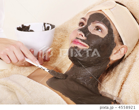 Young woman  having clay body mask. 4558921