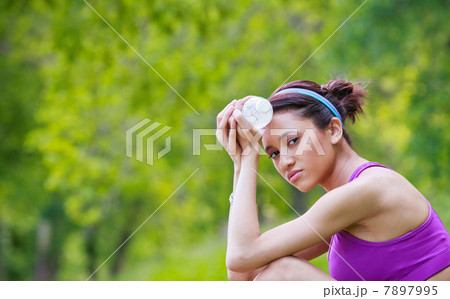 Young woman holding water bottle 7897995