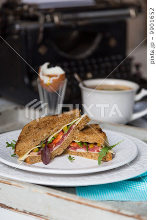 breakfast from toasts, boiled egg and tea on typewriter backgrou 9901652