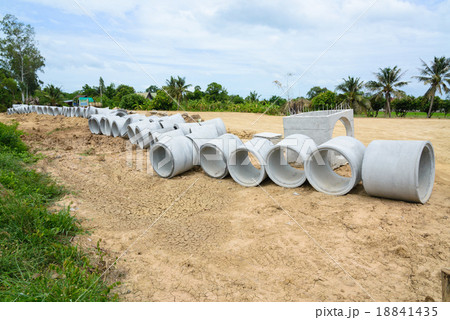 Concrete drainage pipes stacked for construction 18841435