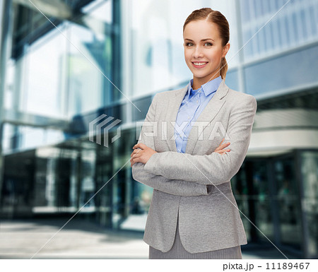 young smiling businesswoman with crossed arms 11189467