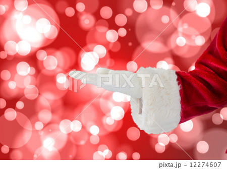 Composite image of santa claus presenting with hand 12274607