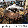 Happy feet. A man relaxing outdoor, withi his feet dirty from wa 12822067