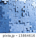 Real photograph of the backside of blue puzzle jigsaw in available light 13864616