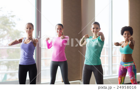 group of happy women working out in gym 24958016