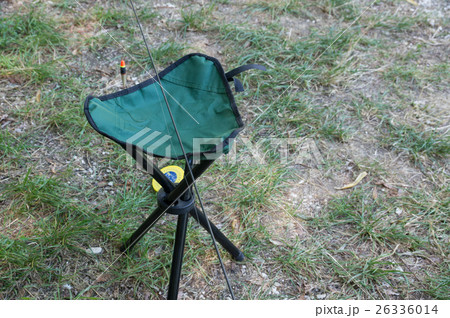 Folding portable shair fisherman on green grass 26336014