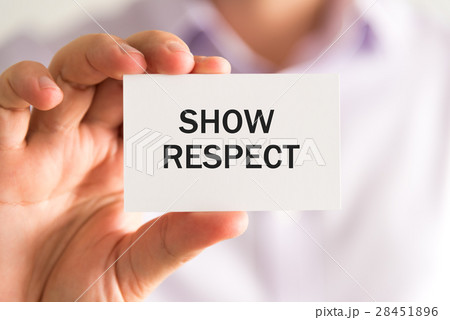 Businessman holding a card with text SHOW RESPECT 28451896