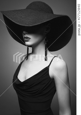 portrait of young lady with black hat and evening dress 47712840