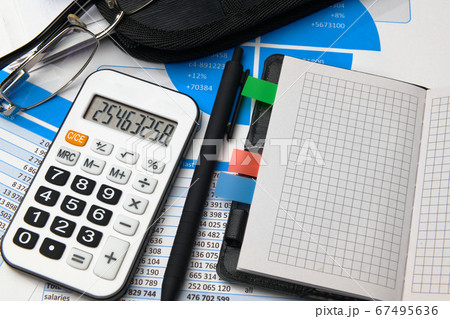 business office desk closeup - financial reports, 67495636