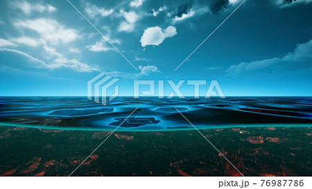 underwater view with horizon and water surface split by waterline 76987786