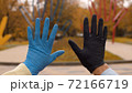 Male and female hands in latex gloves 72166719