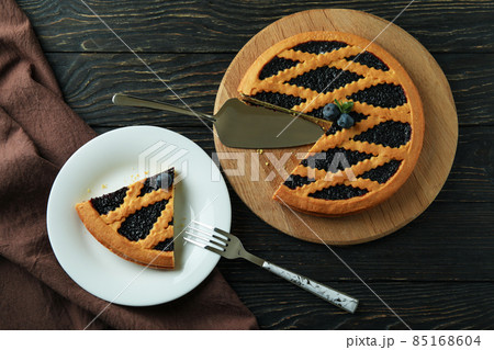 Delicious blueberry pie on rustic wooden background with kitchen towel 85168604