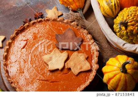 Pumpkin pie and various pumpkins 87153843