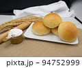 Fresh fragrant bread and bun on the table with copy space. Food concept 94752999