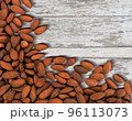 Almond nuts on a white wooden background. 96113073