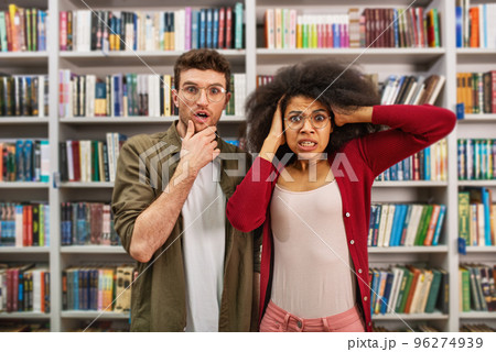 Young student with worried expression in a library 96274939