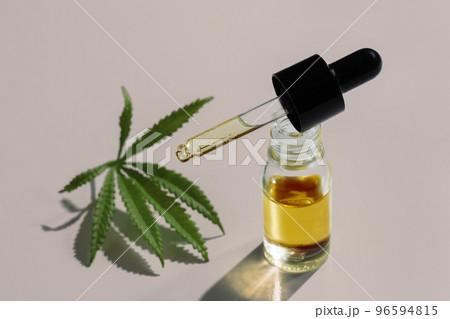 Set of legalized marijuana features with CBD oil product, hemp leaf and bud. 96594815