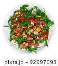 Salad with arugula and chanterelle mushrooms on plate 92997093