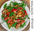 Salad with arugula and chanterelle mushrooms on plate 92997094