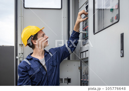 Electrical engineer working in control room. 105776648