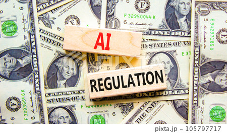 AI regulation symbol. Concept words AI artificial intelligence regulation on wooden block. Beautiful background from dollar bills. Business AI artificial intelligence regulation concept. Copy space 105797717