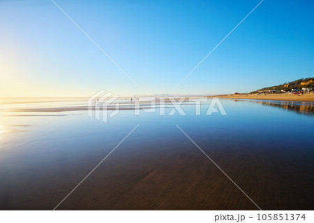 Atlantic ocean sunset with surging waves at Fonte da Telha beach, Costa da Caparica, Portugal 105851374