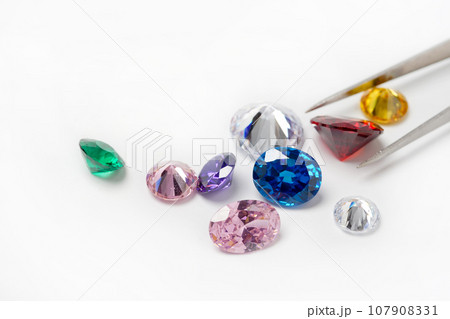 Bright gems isolated on a white background 107908331