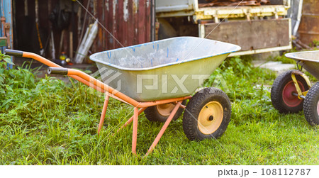 Garden cart standing on the grass 108112787