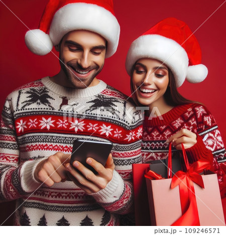 funny sweet young loving couple dressed print pullover buying christmas gifts typing modern gadget on red color background 109246571