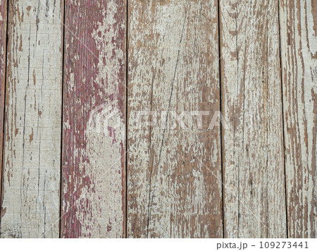 Boards with chipped paint. Old broken wooden boards. Background from boards. Abandoned place. Broken wooden items. 109273441