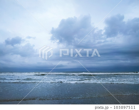 Beautiful cloudy sky over the wave in sea 103897511