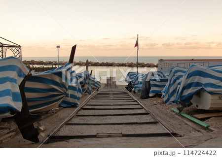 fishermen's boats put back at sunset waiting for a new day 114724422