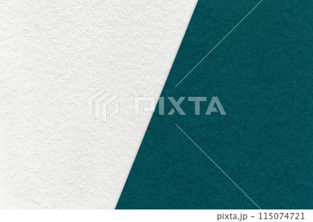 Texture of craft white and emerald paper background, half two colors, macro. Vintage kraft teal cardboard. 115074721