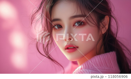 A serene portrait of a Korean woman with soft features, captured in a gentle pink light during a warm afternoon 118056906