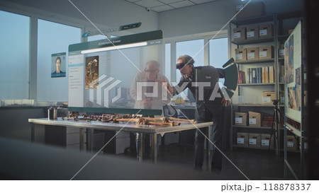 Archaeologists in VR headsets study skeleton using holographic display with AI assistant and browser 118878337