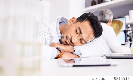 Asian man, scientist and sleeping on desk in laboratory, burnout or overworked in mental health. Tired male person, medical or healthcare worker asleep in lab rest, dreaming or fatigue at workplace 119215538