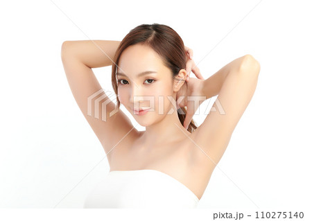 Beautiful Young Asian woman lifting hands up to show off clean and hygienic armpits or underarms on white background, Smooth armpit cleanliness and protection concept 110275140