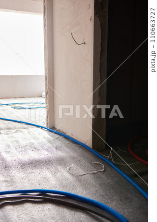 Sheet of expanded polystyrene on the concrete floor for house thermal insulation during constructions 110663727