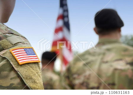 US soldiers. US army. USA patch flag on the US military uniform. Soldiers on the parade ground from the back. Veterans Day. Memorial Day. 110631163