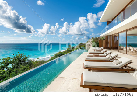 Upscale modern villa with an infinity pool overlooking a stunning tropical ocean view 112771063