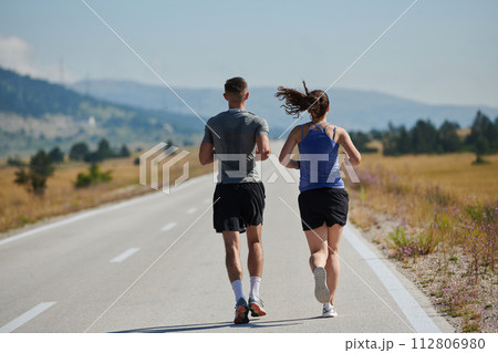 Dynamic Duo: Fitness-Ready Couple Embraces Confidence and Preparation for Upcoming Marathons 112806980