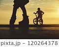 Skateboarding and BMX bike Silhouette Extreme Skatepark Images Orange Sunlight Youth Culture Enjoy Sports Vacation 120264378