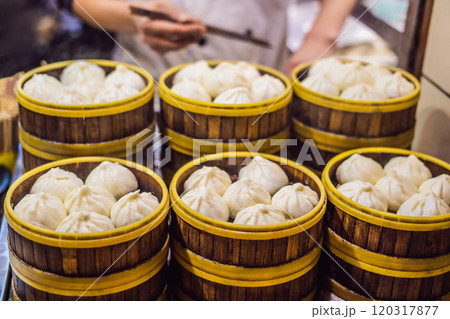 Street food booth selling Chinese specialty Steamed Dumplings in Beijing, China 120317877