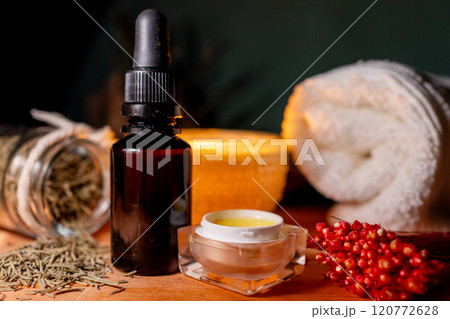 Floral extracts and oils on a wooden table.Cosmetic medicine concept. 120772628