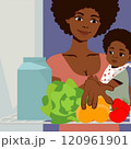 A dark-skinned woman with a baby in her arms peeks into the refrigerator 120961901