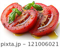 Freshly sliced tomatoes drizzled with olive oil and sprinkled with herbs create vibrant and appetizing dish. rich colors and textures evoke sense of freshness and flavor 121006021