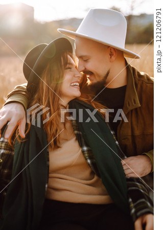 Lovely hipster couple enjoying each other in the autumn park. Nice autumn day. love and lifestyle. 121206791