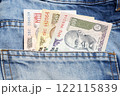 Indian rupee in the pocket of blue jeans 122115839